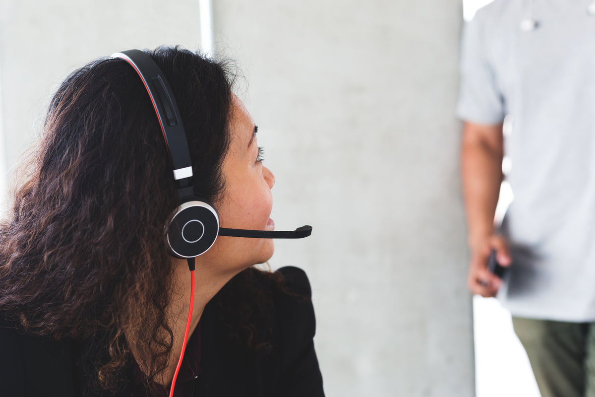 A customer service adviser wearing a headset